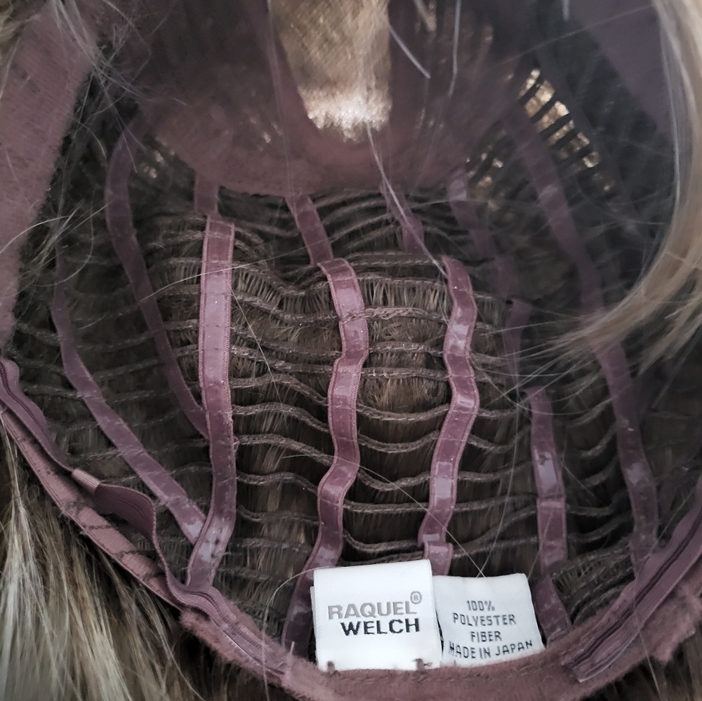 Raquel Welch Wig Color is shaded biscuit.